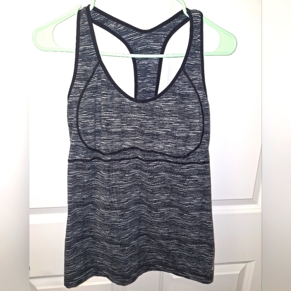 A Reebok ladies tank top in a size large with an open back. EUC. Black and grey. - Picture 1 of 6